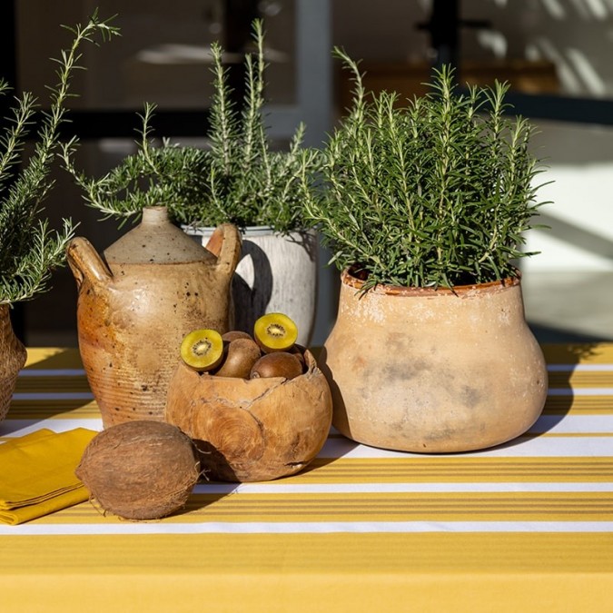 Yellow and white striped coated tablecloth