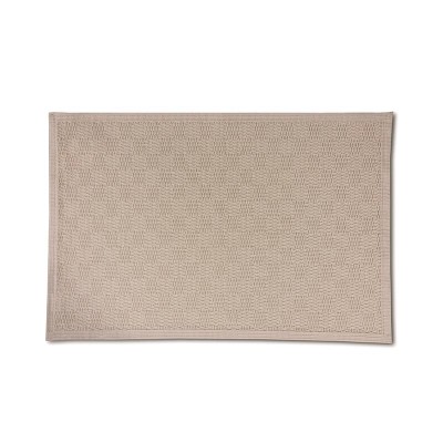 Beige bath mat with soft relief woven pattern