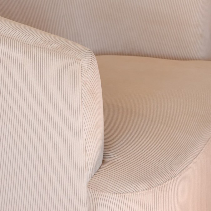 Trendy round beige armchair in soft velvet