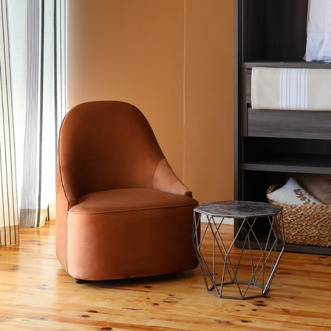 Trendy terracotta brown swivel armchair in velvet fabric