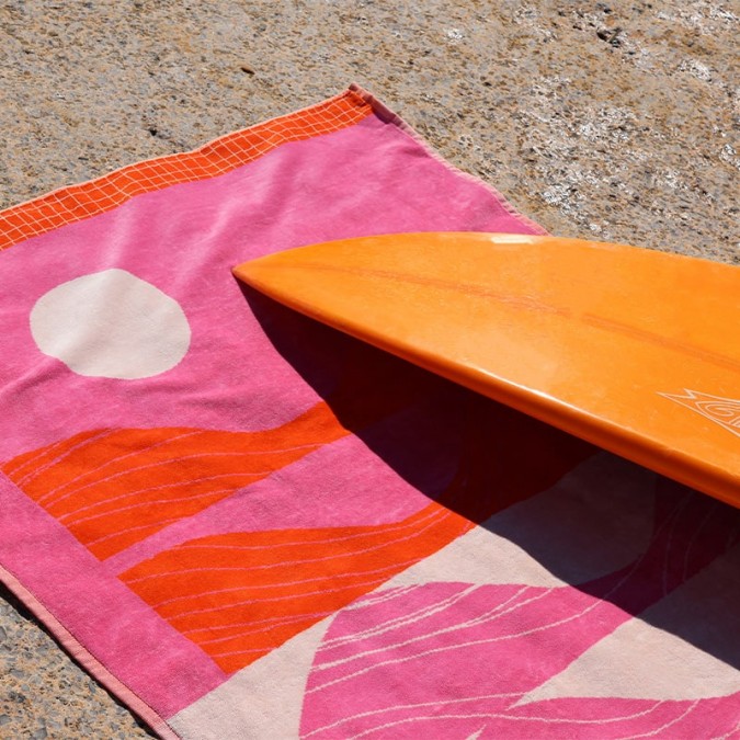 Colourful beach towel reminiscent of a sunset