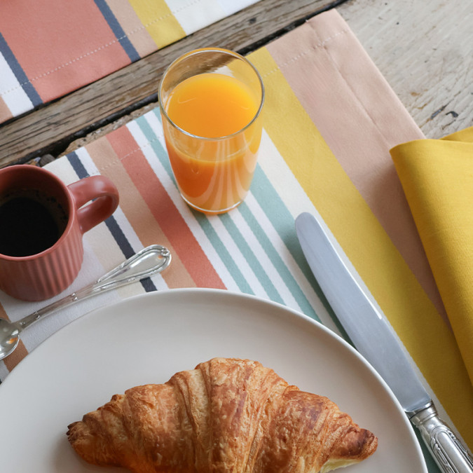 Stain-resistant coated cotton place mat with colourful Basque stripes
