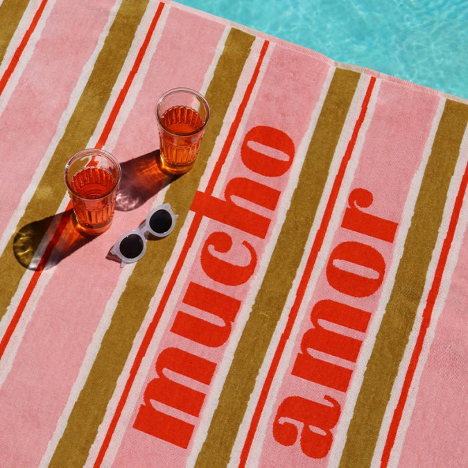 Trendy beach towel in red, green and pink with stripes and cotton lettering
