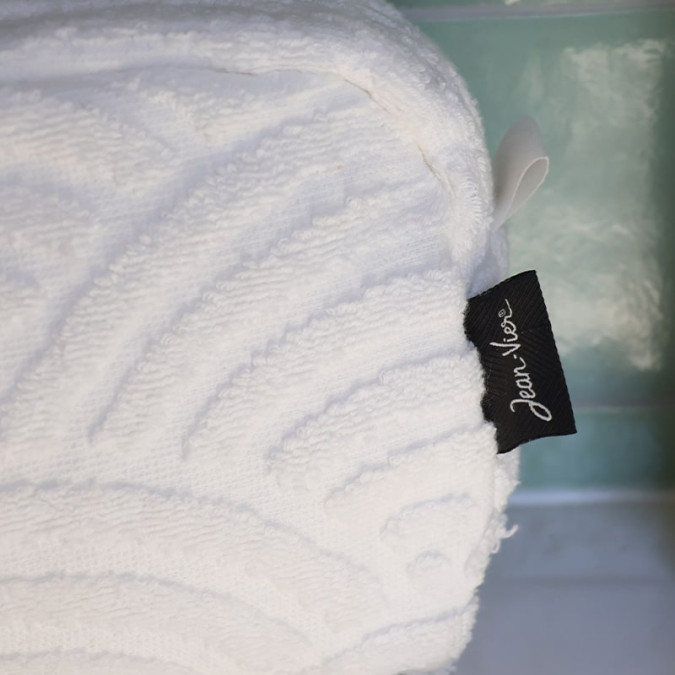 White travel beauty case with graphic pattern